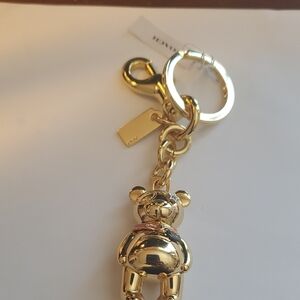 Coach Gold Teddy Bear Keychain.